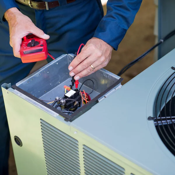Man Diagnosing Air Conditioning Issue